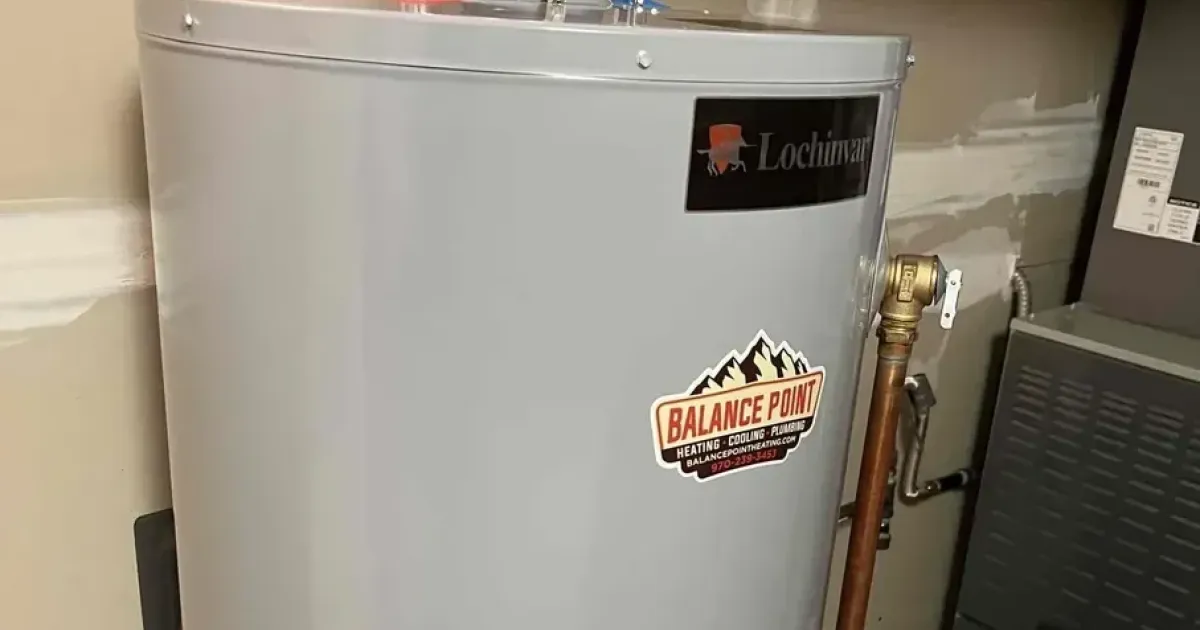 A newly installed Lochinvar gas tank-style water heater connected with clean copper piping and proper venting.