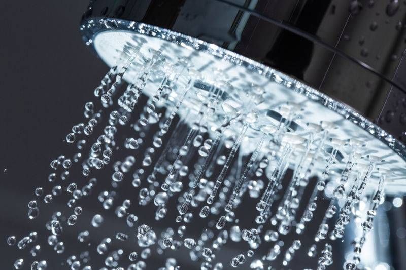 Shower Head with water stream in a home in Fort Collins