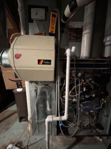 Furnace and Aprilaire humidifier during a burner replacement by Balance Point Heating, Cooling & Plumbing in Fort Collins