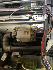 High-efficiency furnace serviced by Balance Point Heating, Cooling & Plumbing for a collector box replacement in Loveland