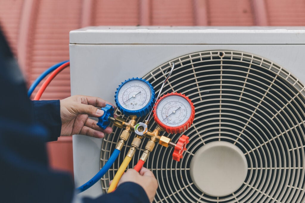 Technician servicing a cooling system in Fort Collins