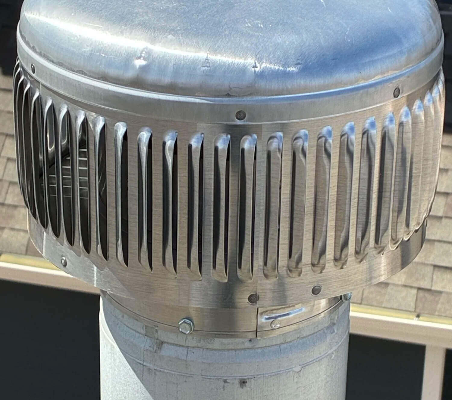 Furnace flue exhaust cap on the roof of a Fort Collins home served by Balance Point Heating, Cooling & Plumbing