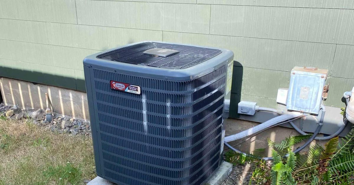 AC condenser unit outside a Northern Colorado home served by Balance Point Heating, Cooling & Plumbing