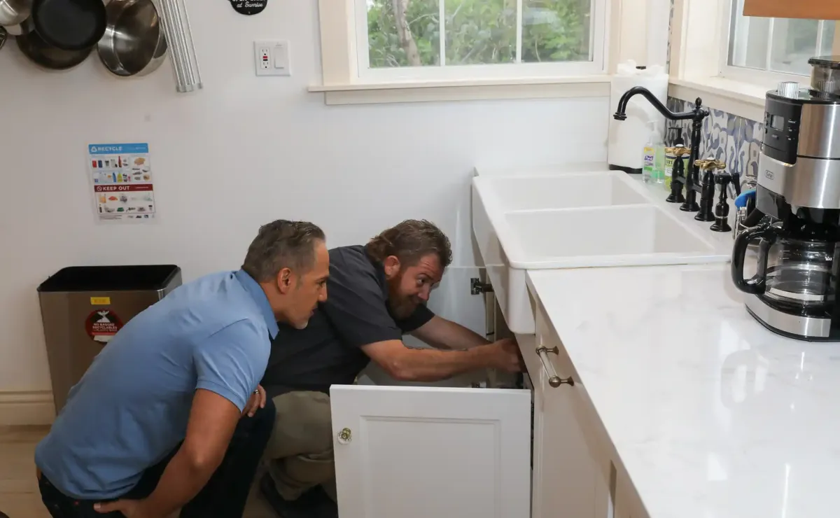 Image of a wrench tightening a leaking faucet