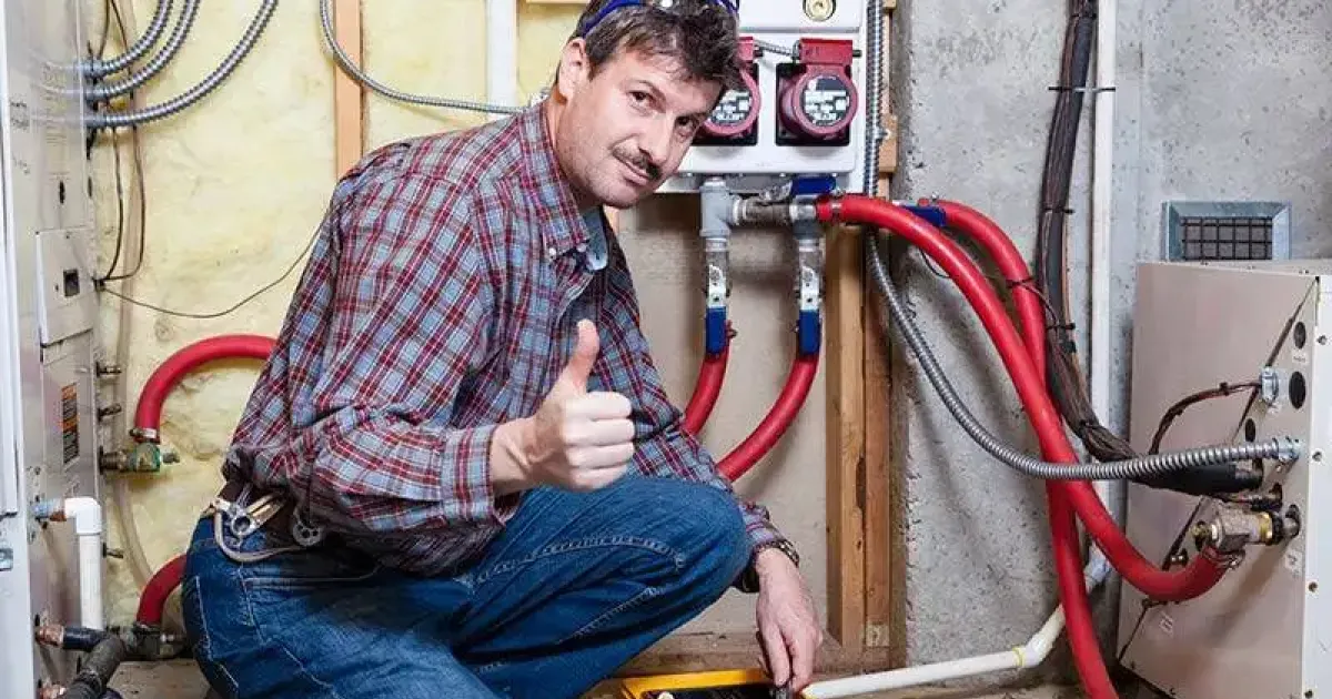 Technician after repairing an HVAC system in Fort Collins.