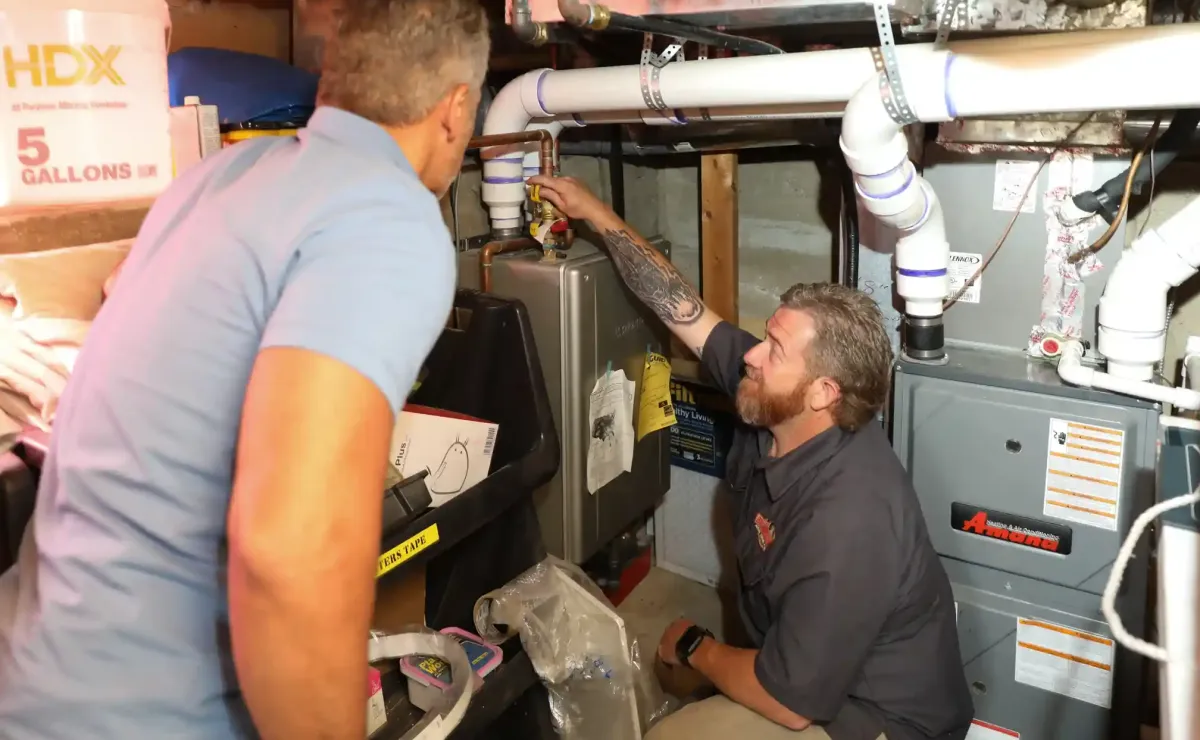 Technician repairing a furnace