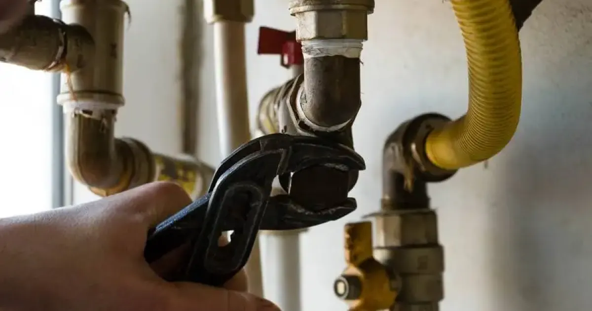 Technician fixing a boiler in Colorado homes.
